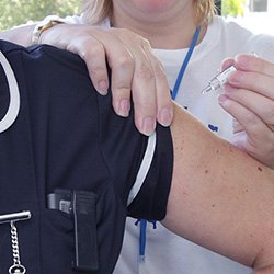 Nurse receiving flu vaccination