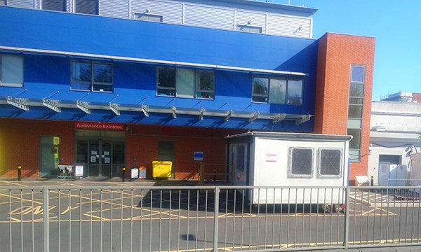 Picture shows entrance to the emergency department at Medway Maritime Hospital in Gillingham with a cabin used for forward triage.