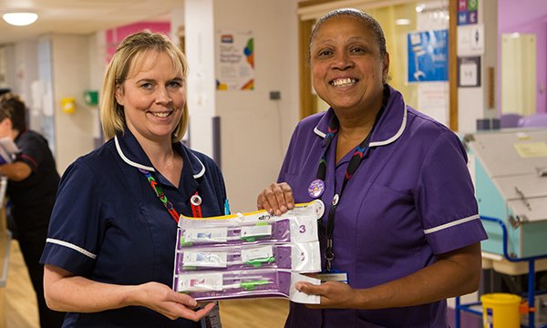 Picture shows nurses Angela Chick and Ahlam Wynne with their oral hygiene kits, which have transformed mouth care practice in their trust,  Chelsea and Westminster Hospital NHS Foundation Trust.