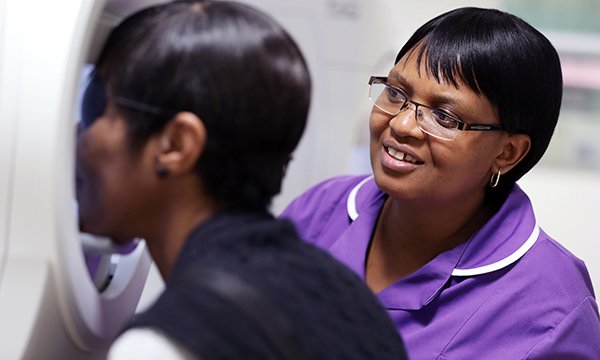 Taurai Matare, ophthalmology matron at Whipps Cross Hospital in London and RCN Nurse of the Year 2019, with a patient