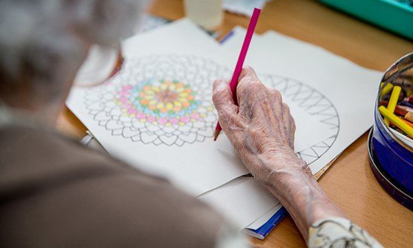 person doing an colouring activity