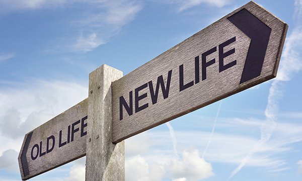 road signs pointing to 'old life' and 'new life'