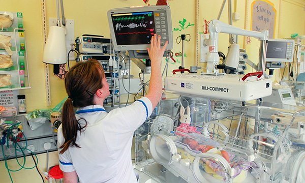Neonatal nurse on premature baby unit. Services are facing a nurse staffing crisis 
