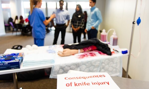 Image shows emergency nurse training students to treat young people affected by knife wounds