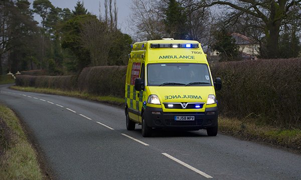 Ambulance driving on a country road