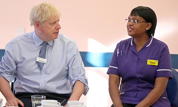 Taurai Matare, ophthalmology matron at Whipps Cross Hospital in London, and RCN Nurse of the Year 2019, meets prime minister Boris Johnson