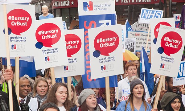 RCN activists protest against the removal of the nursing bursary. They are holding banners saying '#BursaryorBust'