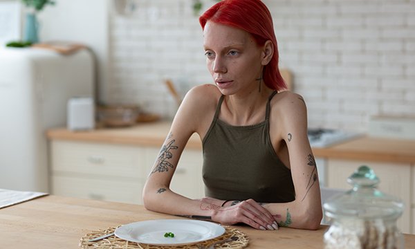 Young woman with eating disorder