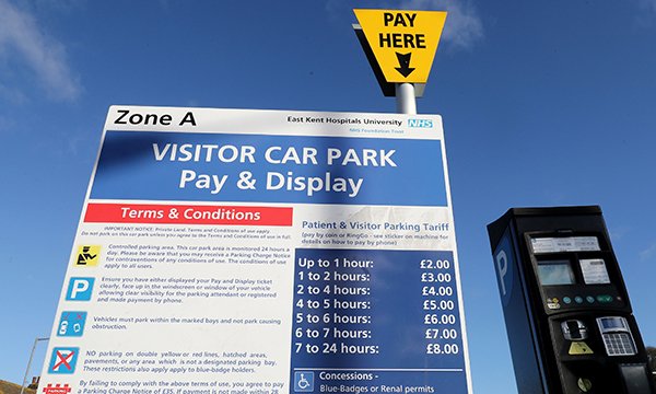 A sign displaying parking charges at Buckland Hospital in Dover, Kent. Hospital car parking charges will be waived for nurses and other NHS staff on night shifts and some patients and parents of sick children.