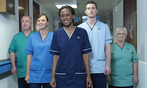 The Scottish national nursing uniform uses different shades of blue to differentiate between roles
