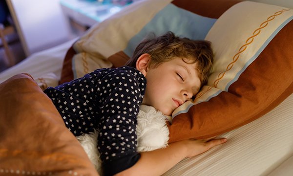 Picture shows a child sleeping. Scientists say a blood molecule could be used in a test to show if children get enough sleep or are susceptible to certain health conditions.