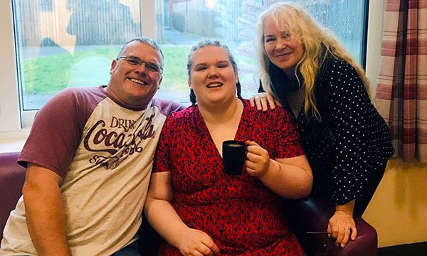 Image shows service user Bethany with her father and mother