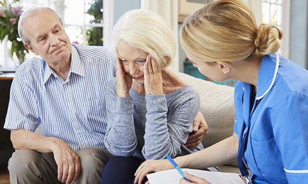 Picture shows an older couple, the woman appearing confused and a nurse looking at her. Five principles on care for people with dementia are set out in a new RCN document.