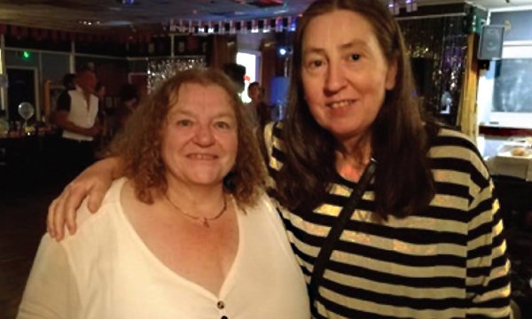 Picture of Clare Wood with her carer, Sandy. She describes her struggle with paranoid schizophrenia and appeals nurses to encourage hope, show empathy and understand that recovery is unique for each service user.