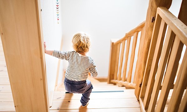 A small child at the top of a staircase. More than 100,000 children per year are admitted to hospital due to accidental injuries (Picture: iStock)
