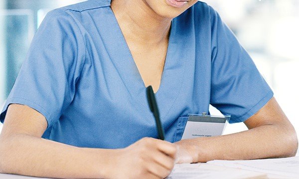 A nurse sitting an exam. Overseas-trained nurses will have to pay to take the test to stay on the register. Picture: iStock