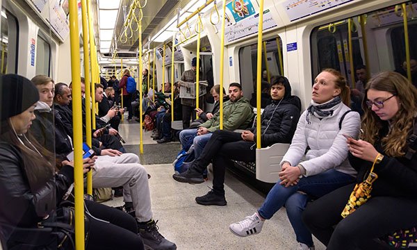 Unmasked passengers on tube train