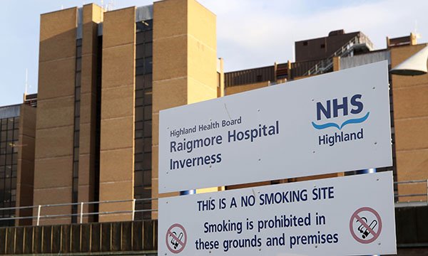 Raigmore Hospital with signboard in front of building