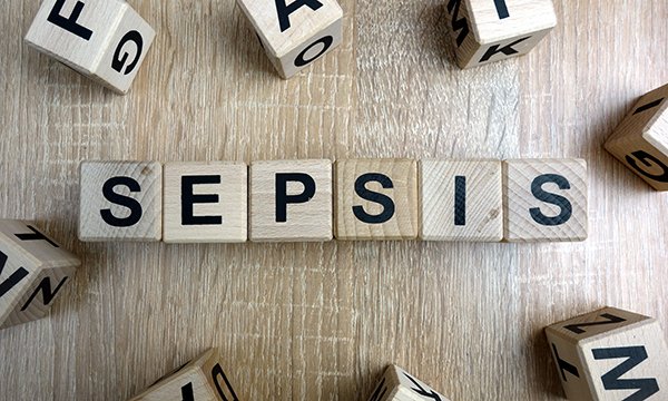 Illustration shows SEPSIS spelt out in wooden cubes: The UK Sepsis Trust and Marie Cure's latest version of the Sepsis Six tool helps nurses in the community to assess risk to patients and guide decision making