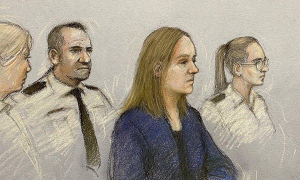 Court sketch of nurse Lucy Letby looking sombre and flanked by three uniformed police officers: she is accused of murdering seven babies