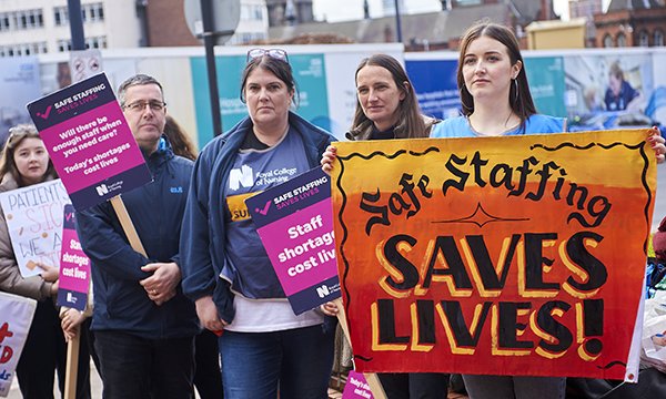 Striking nurses holds protest placards outside Leeds General Infirmary on 1 May 2023
