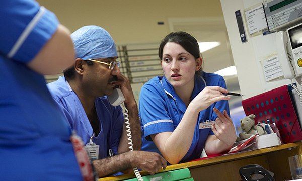 Photo of busy nurses on ward, illustrating story on concerns about staff burnout