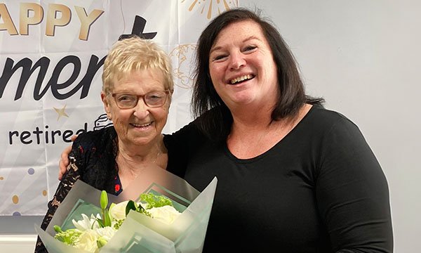 Photo of Norma Newcombe celebrating her retirement with colleague Sharon Swift