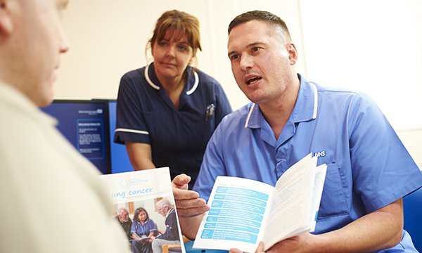 Cancer nurse specialists with a patient