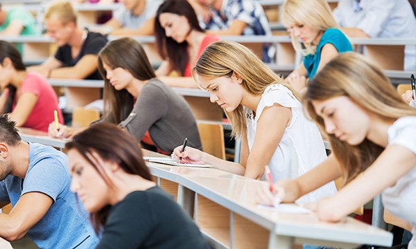 Several students sat in a lecture theatre