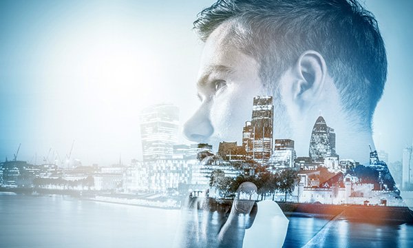 A young man's face superimposed over the London skyline