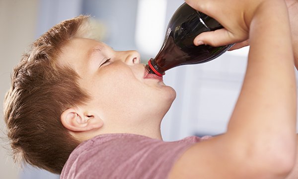 Child drinking sugary drink