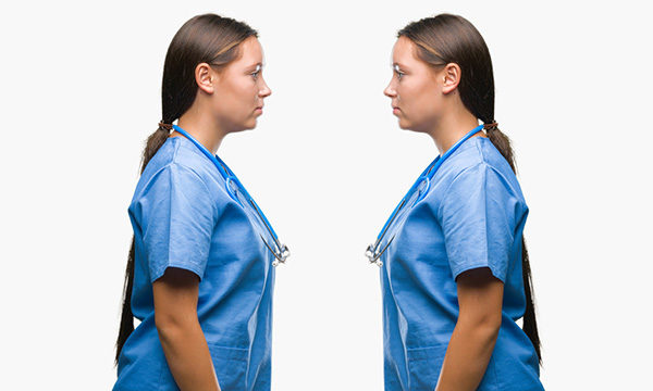 identical nurses face each other
