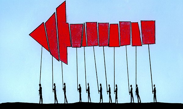 Illustration depicting a line of figures carrying placards which together form a large  arrow pointing forward. In this article senior nurses discuss how to remove the culture of fear and create a compassionate workplace in which everyone feels valued.
