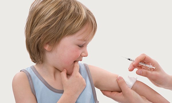 Photo of a child receiving a vaccination