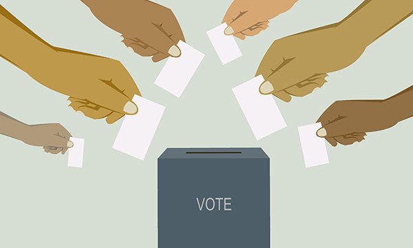 illustration shows hands posting ballot papers into a ballot box as Northern Ireland RCN members prepare to vote on whether to take industrial action