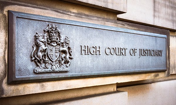 Sign outside High Court in Edinburgh, which reads 'High Court of Justiciary'