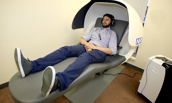 A junior doctor trying out a sleep pod