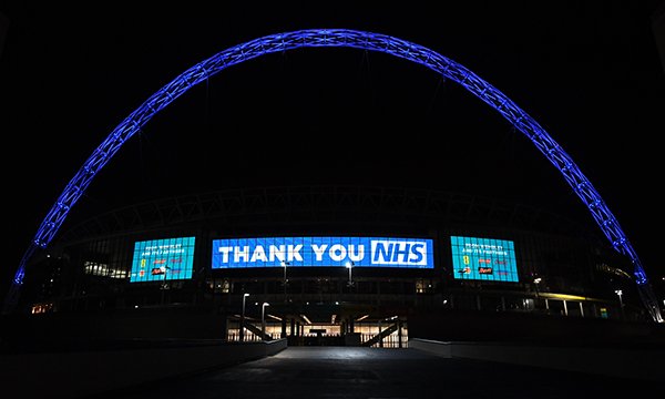 Wembley Stadium lit up blue