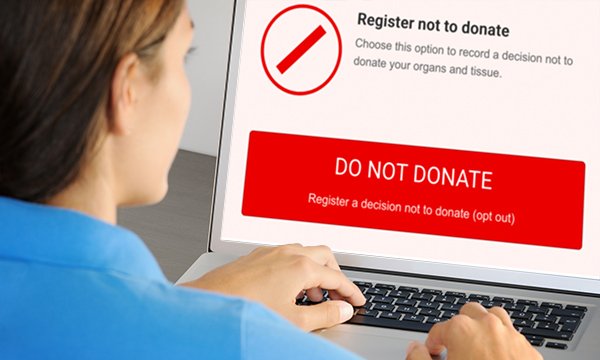 A woman looking at a web page in relation to organ donation, which reads 'register to not donate'