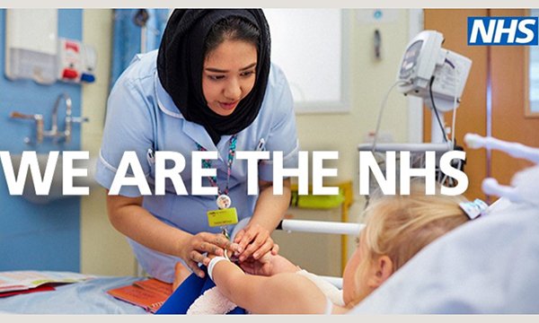 A nurse treats a patient with the words WE ARE THE NHS over the photograph and an NHS logo. The adverts use nurses's words to describe their profession. Picture: NHS 