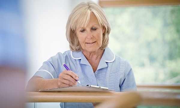 Picture of an older woman in nurse's uniform