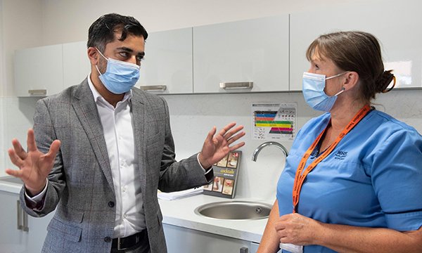 SNP health and social care secretary Humza Yousaf pictured meeting a nurse