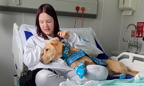 Kiera and her assistance dog Noodle at Royal Surrey Hospital
