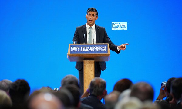 Rishi Sunak addresses audience at Conservative Party conference podium