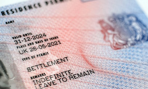 Close-up of a passport visa with proof of an indefinite leave to remain