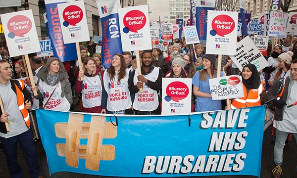 Protestors holding 'Save NHS bursary' sign