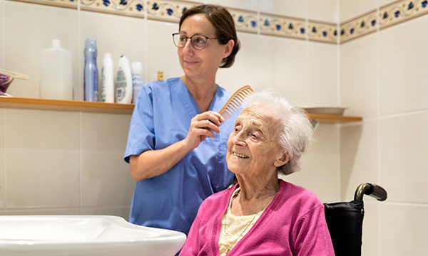 Care home staff with resident