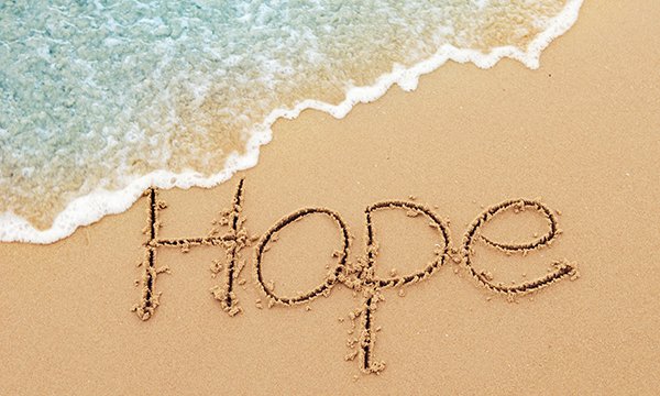 The word ‘Hope’ written in sand on a beach. Picture: iStock
