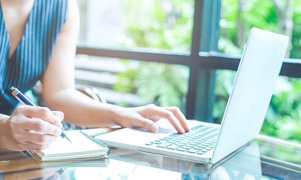 Picture shows a woman using a computer and writing in a notebook.  Liz Halcomb, editor of Nurse Researcher, lists five reasons why it is worth taking the extra step of publishing work about your methodology or research methods.