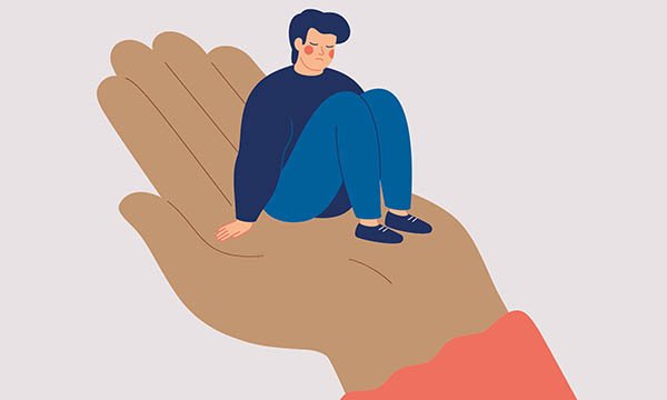 Illustration shows a sad person being held up by a large hand, to represent mental health nurses being supported